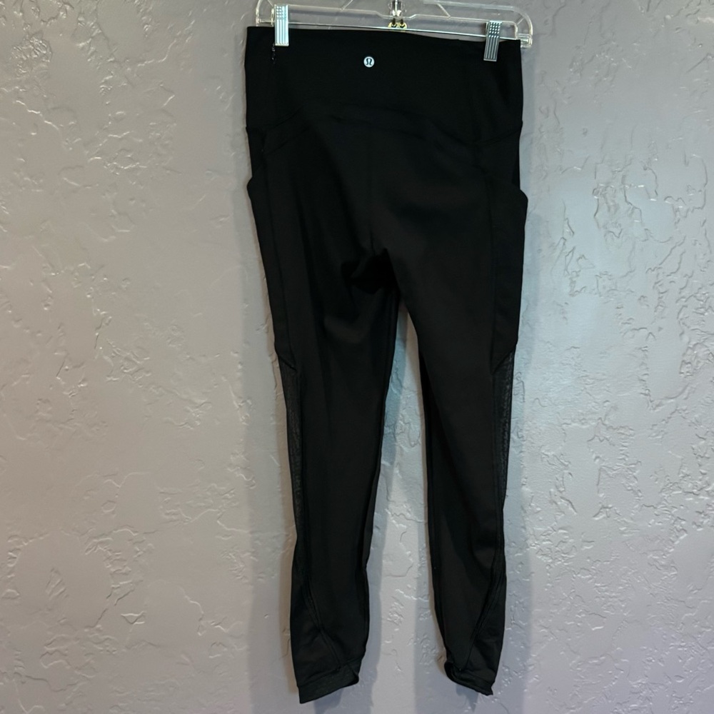 Lululemon athletica black leggings with mesh, size 8.